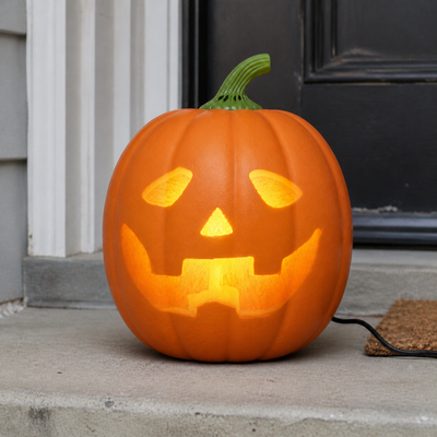 Jabberin Jack talking pumpkin active on a realistic covered porch.